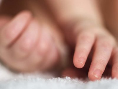 newborn-baby-hands-in-a-fluffy-blanket